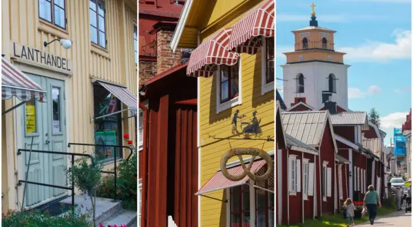 En mysig stad i Sverige med en gammal lanthandel, gula och röda hus samt en kyrka.