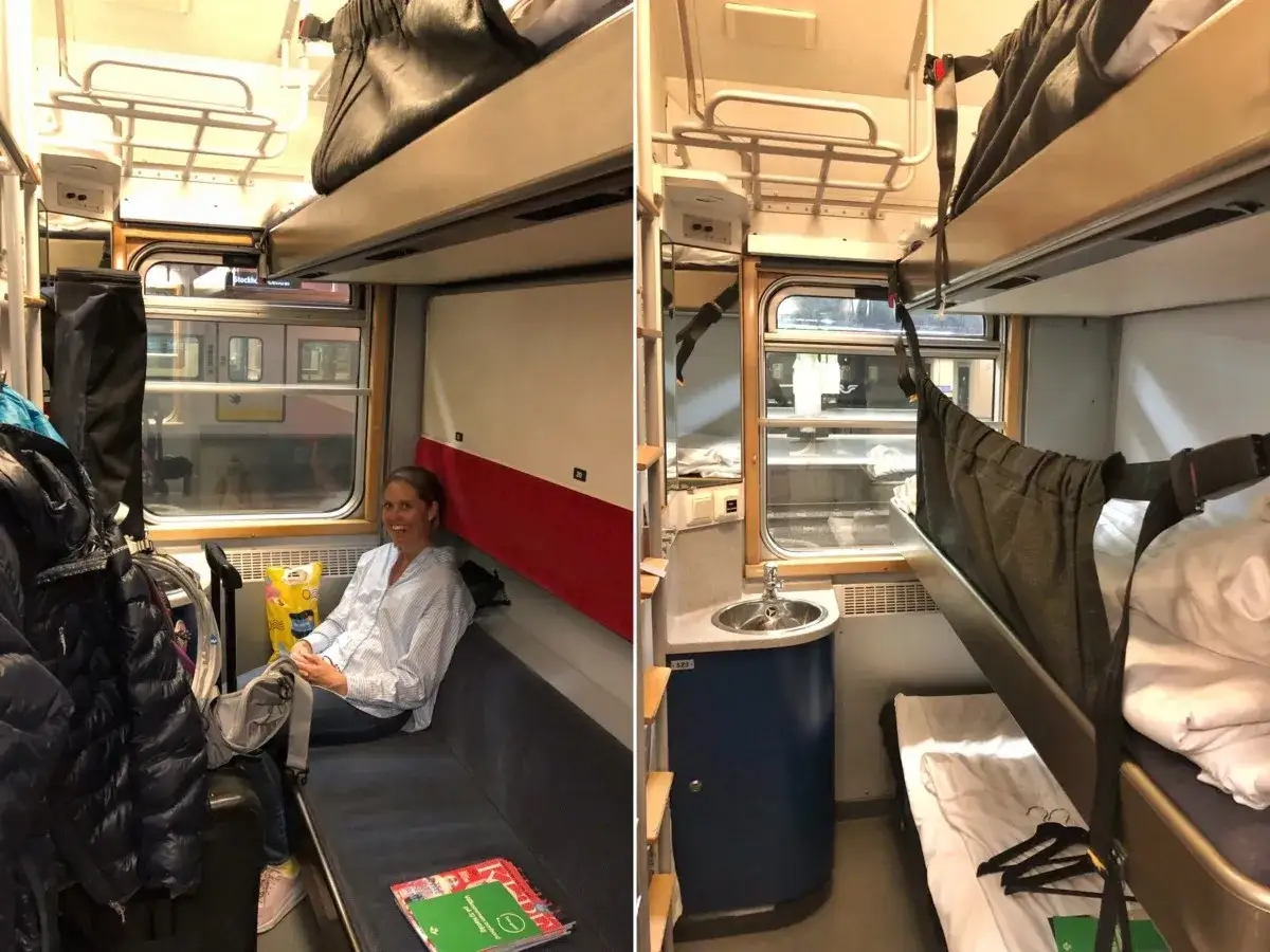 En kvinna sitter i en SJ Euronight-kupé med våningssängar. Bagage hänger på krokar.